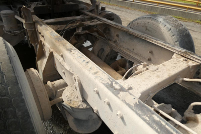 Peterbilt truck frame showing chassis and rear axle area with dirt and wear.
