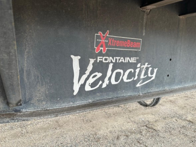 Fontaine Velocity logo on flatbed trailer side showing XtremeBeam and Fontaine Velocity branding.