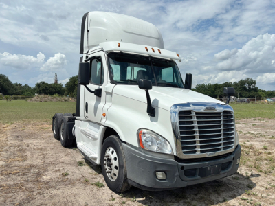 Truck cab in-service 2016 Freightliner Cascadia Evolution with large grille and dual rear axles showing VIN 3AKJGED57GSGX5193 and stock 554295
