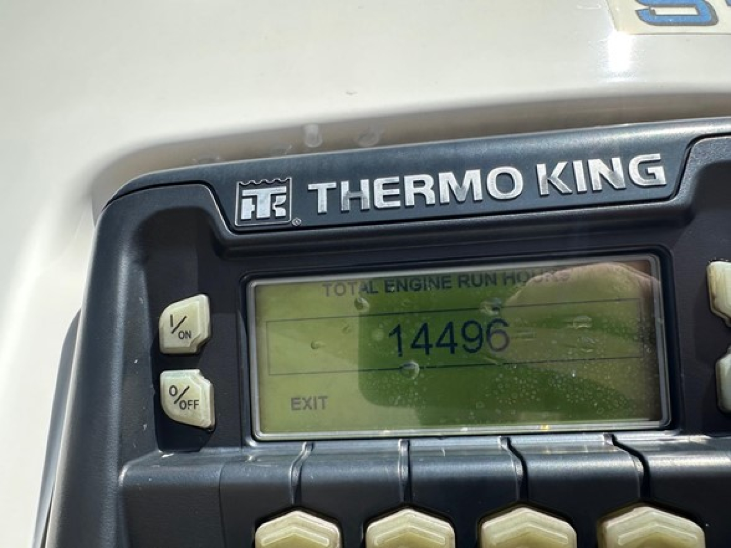 Thermo King refrigeration unit on a 2021 Utility trailer showing total engine run hours reading 14496 on the display.
