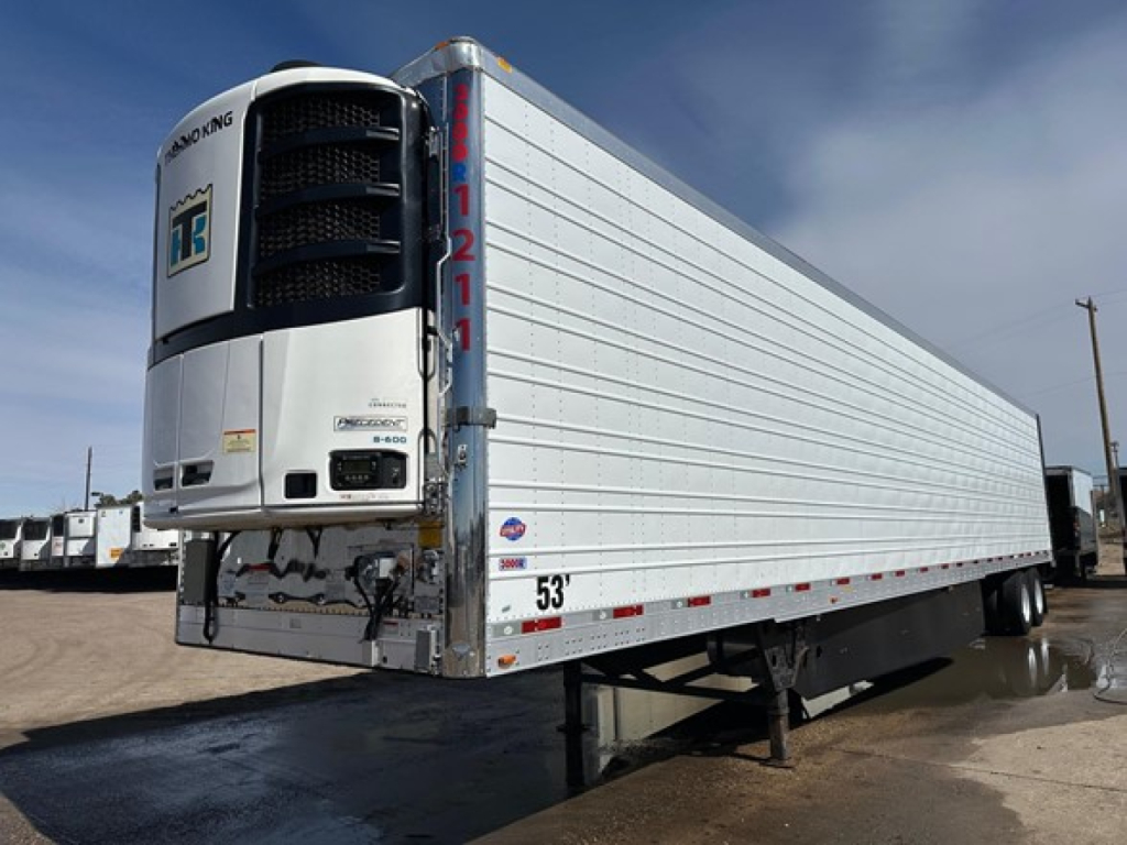 Trailer side view showing a white utility 3000R refrigerated trailer with a Thermo King unit at the front, serial numbers and decals visible.