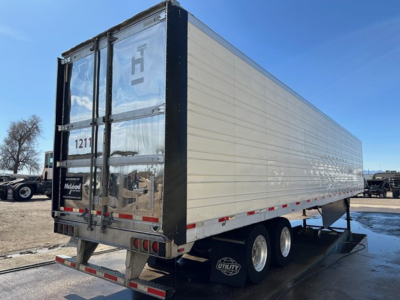 Utility 3000R trailer rear and side view showing aluminum siding and dual rear doors.