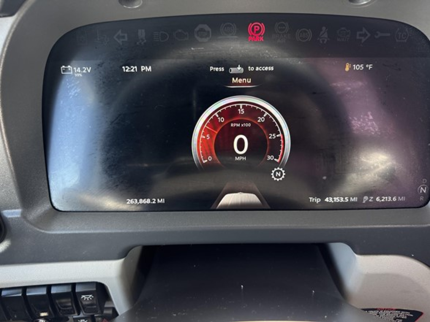 Peterbilt 579 instrument cluster display and dashboard showing digital tachometer at 0 mph, various icons, and ambient readings.