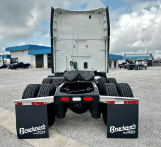 Truck rear view showing fifth wheel area and dual rear axles with mud flaps reading Bruckner's Truck & Equipment.