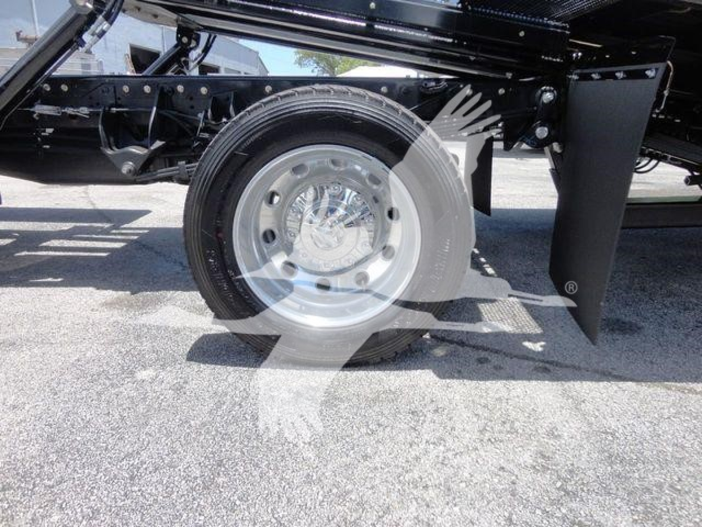 Truck rear wheel and suspension undercarriage with chrome wheel, part of Ram 5500 chassis.