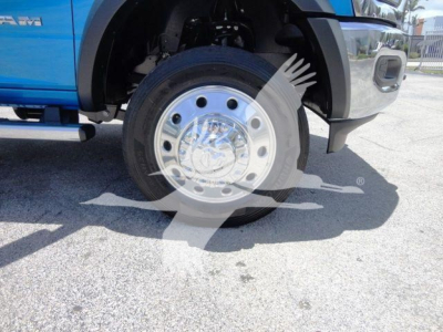 Ram 5500 front wheel and fender showing wheel hub and tire with blue bodywork.