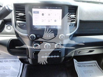 Dashboard of a 2024 Ram 5500 SLT showing a central touchscreen display, climate controls, and steering wheel on left; no other legible text visible.