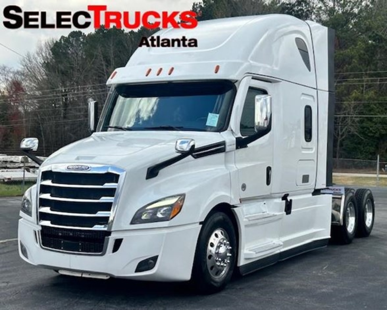 Front three-quarter view of a white 2023 Freightliner Cascadia 126 sleeper tractor showing glossy cab, chrome grille, and dual rear axles.