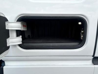 Freightliner Cascadia 126 truck cab with open side storage bay