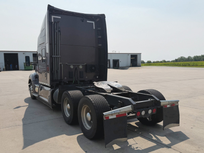 Kenworth T-680 truck rear view showing fifth wheel and dual rear axles.