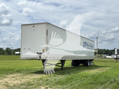 Utility trailer 2023 model 4000D-X with RiverValley Transportation logo shown in a grassy lot.