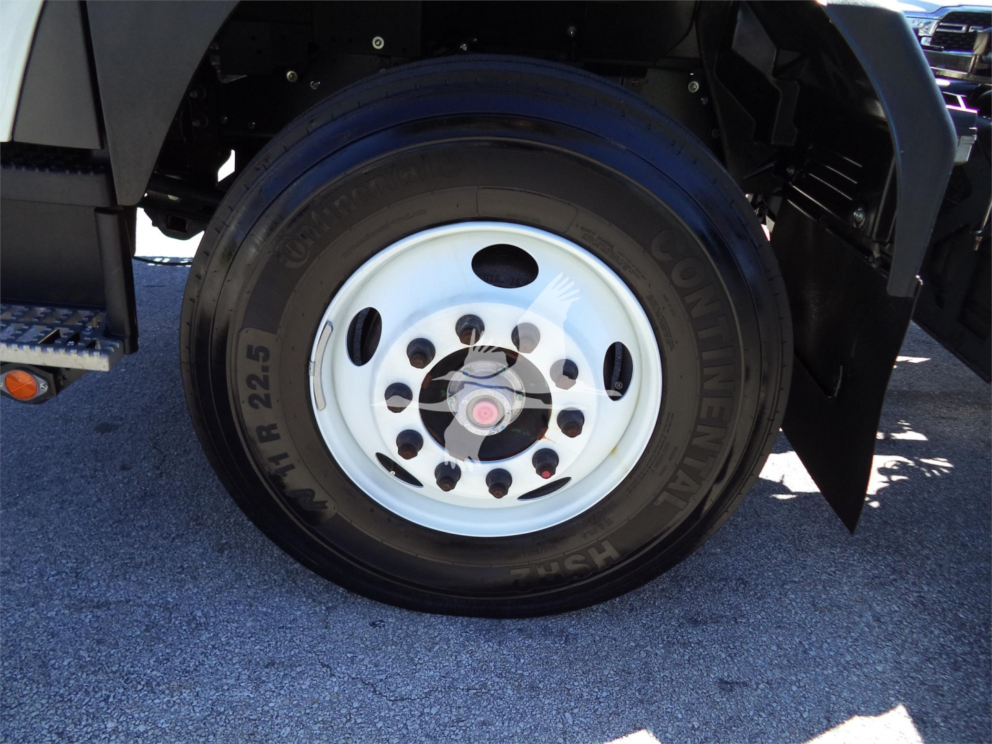 Isuzu FTR truck wheel with tire brand and size visible on the sidewall.