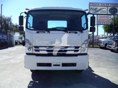 Isuzu rollback truck front view showing Isuzu logo on grille, headlights, large bumper, and side mirrors.