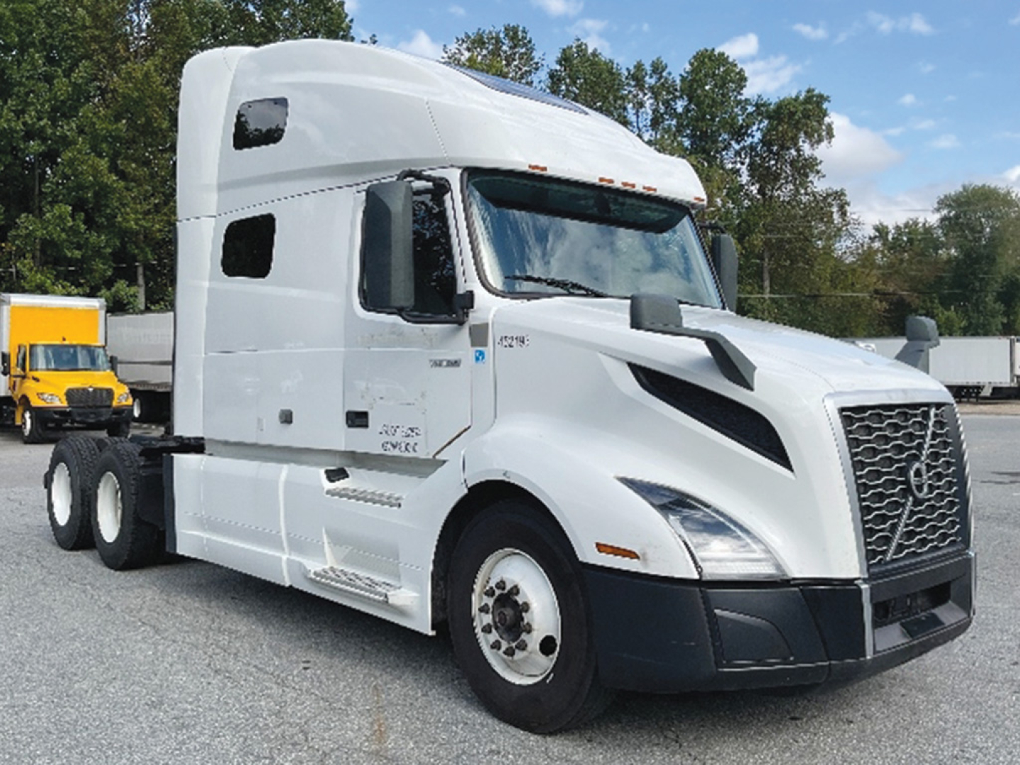 Volvo VNL 760 highway tractor in white showing sleeper cab and aerodynamic hood.