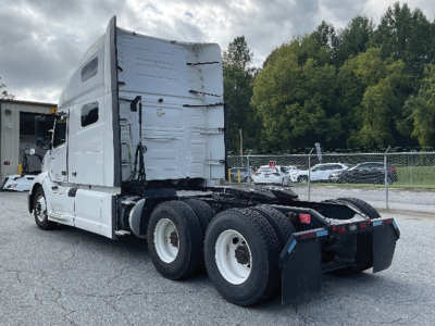 2022 Volvo VNL 760 tractor cabin and rear chassis view showing sleeper cab, dual rear axles, and fifth-wheel area.
