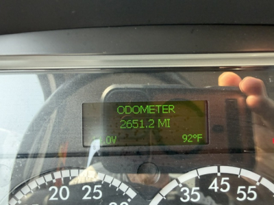 Digital odometer display reading 2651.2 MI with 92°F outside temperature in cab; gauge cluster visible.