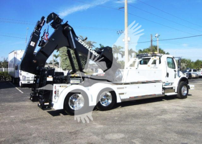 Truck with a large black hydraulic crane on a white Freightliner Business Class M2 106 chassis, side view, hydraulic winch equipment visible.