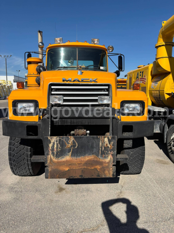 Mack RD688P cab and chassis front view showing large grille and bumper with mud-plate and headlights.