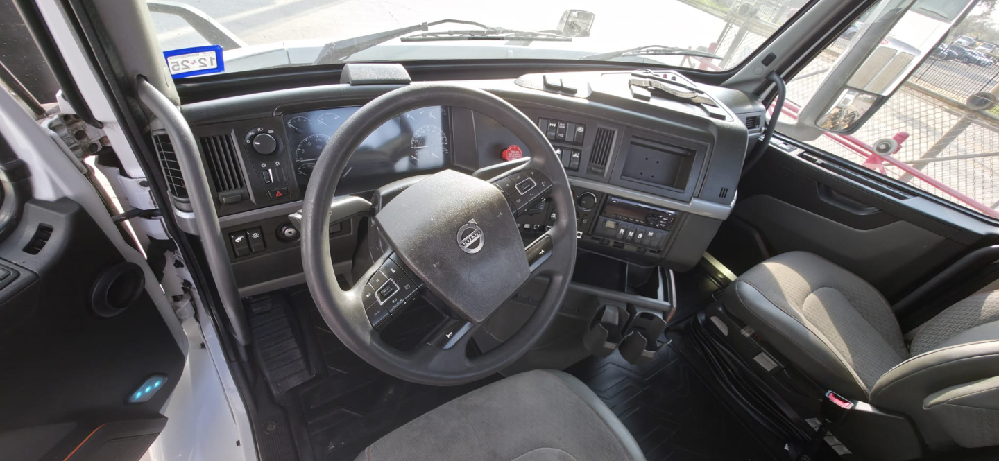 Cab interior of a 2019 Hino 155 box truck showing steering wheel dashboard and driver seat