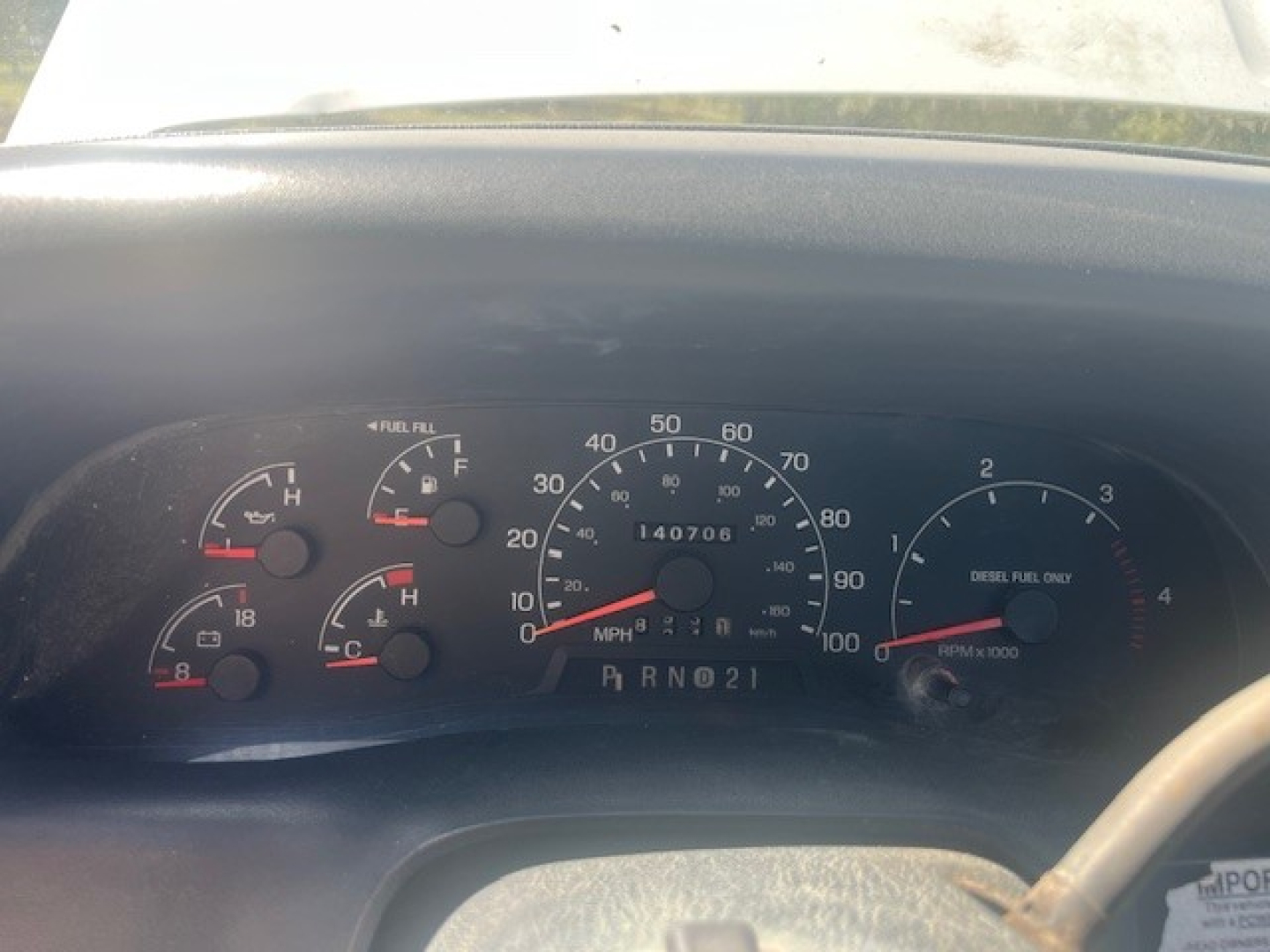 Ford F-550 cab and chassis instrument cluster showing speedometer, fuel gauge, and engine gauges; odometer reads 140,706 miles; gear indicator P R N D 2 1.