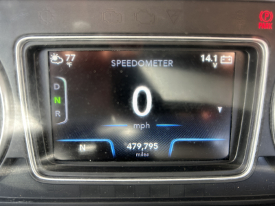 Speedometer display showing 0 mph with gear indicator D N R and N 479,795 miles; top shows 77 F exterior; right shows 14.1 V. Vehicle digital gauge cluster present.