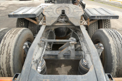 Frame and rear chassis of a 2018 Mack CXU613T truck showing chassis rails, dual rear axles, and seventh wheel area.