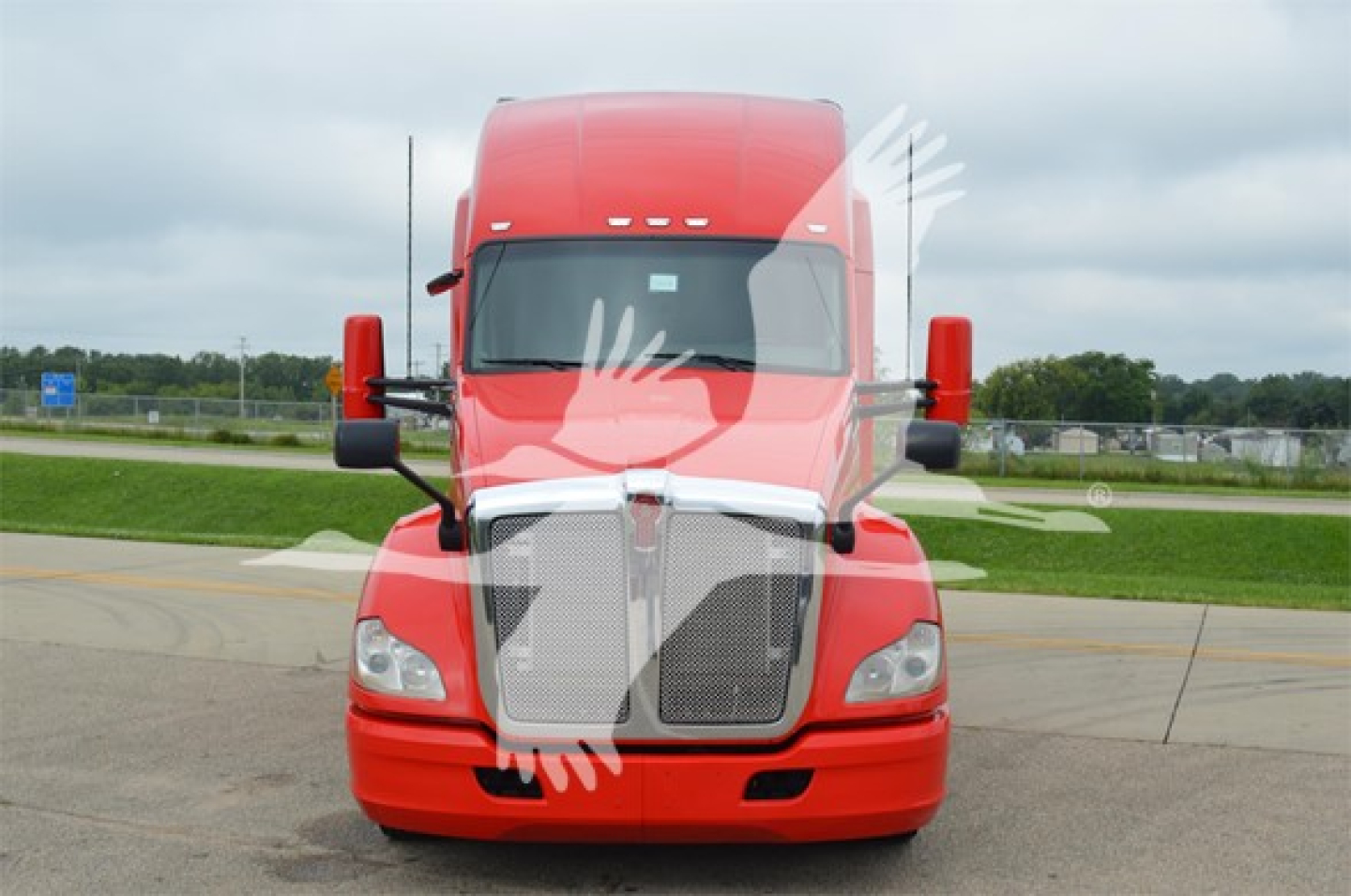 Front view of a red 2018 Kenworth T680 truck showing grille, headlights, windshield, and mirrors.