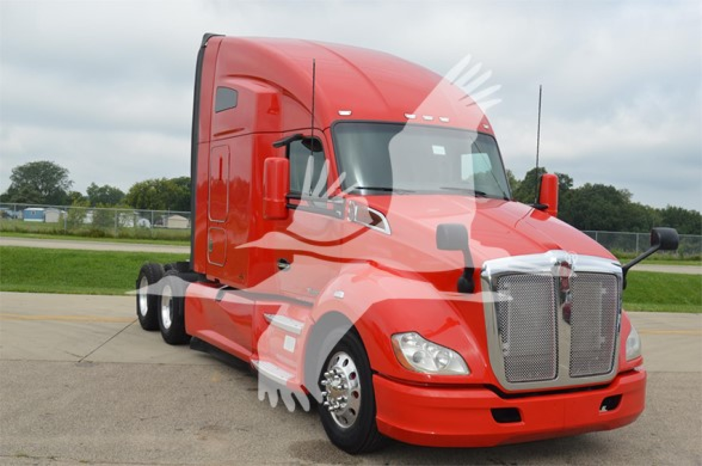 Kenworth T680 truck in red, front-three-quarter view, showing cab and grille, no visible text