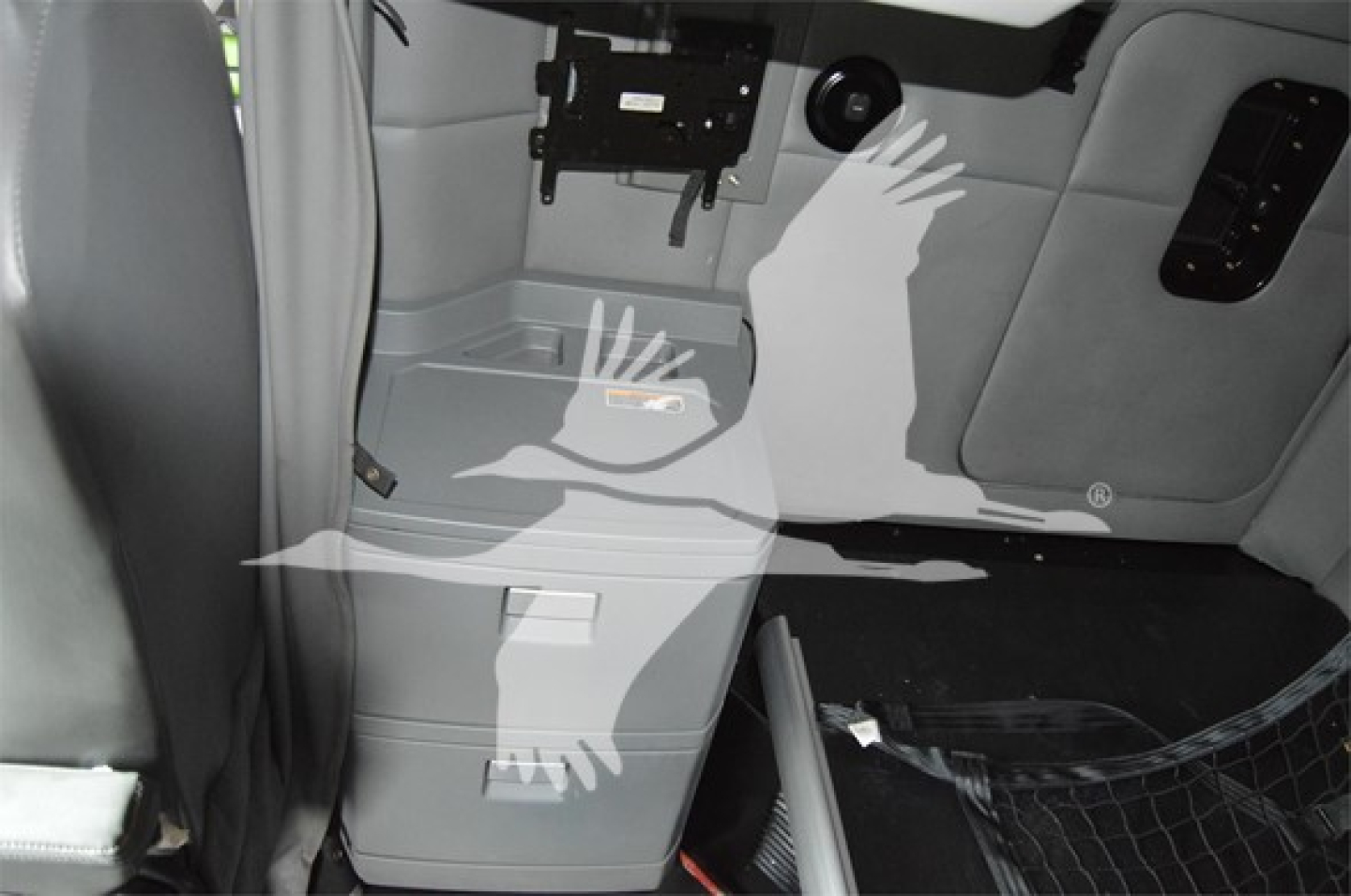 Kenworth T680 interior cab showing storage compartment and cargo area with plastic panels.