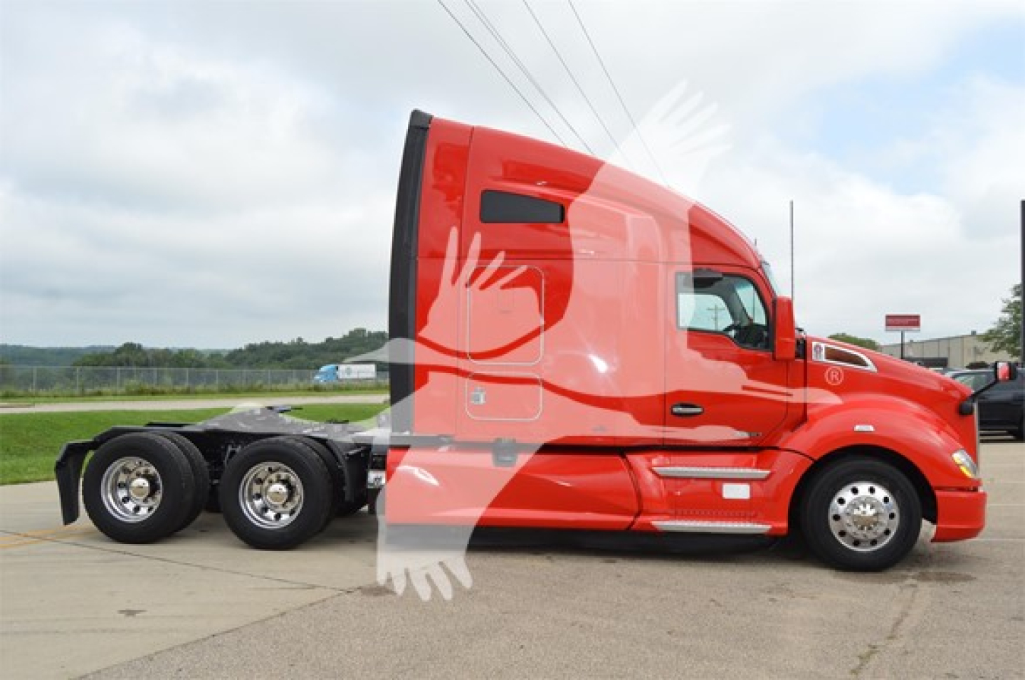 Kenworth T680 tractor in red, side profile view showing sleeper cab, six-wheel rear, aerodynamic mirrors, and wheel rims.