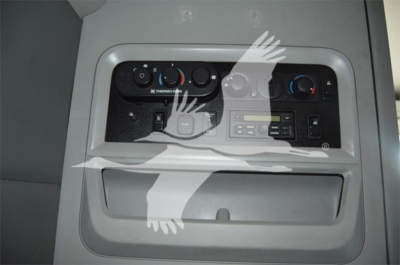 Kenworth T680 truck interior console with climate controls and a small display; visible text includes 'ICE THERM', various knobs, and a panel.