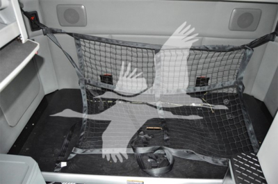 Kenworth T680 bed area showing cargo net and interior storage in the sleeper with netted pocket