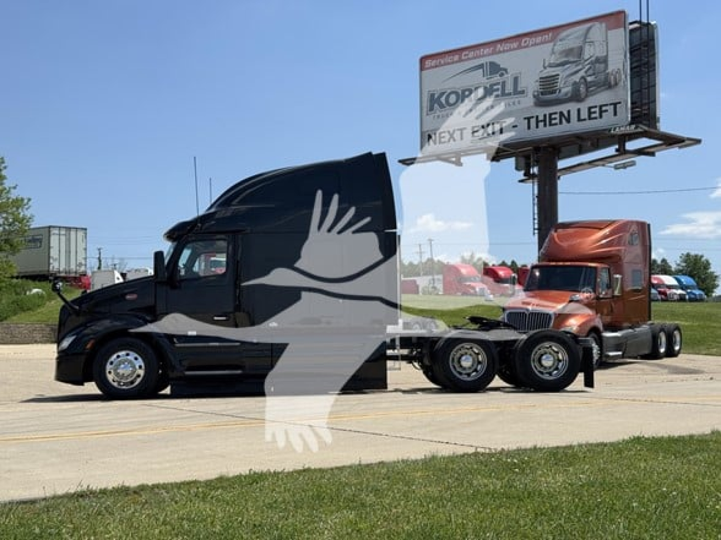 Peterbilt 579 tractor-trailer in profile showing black cab and long hood, with a second truck attached behind, in a parking lot.