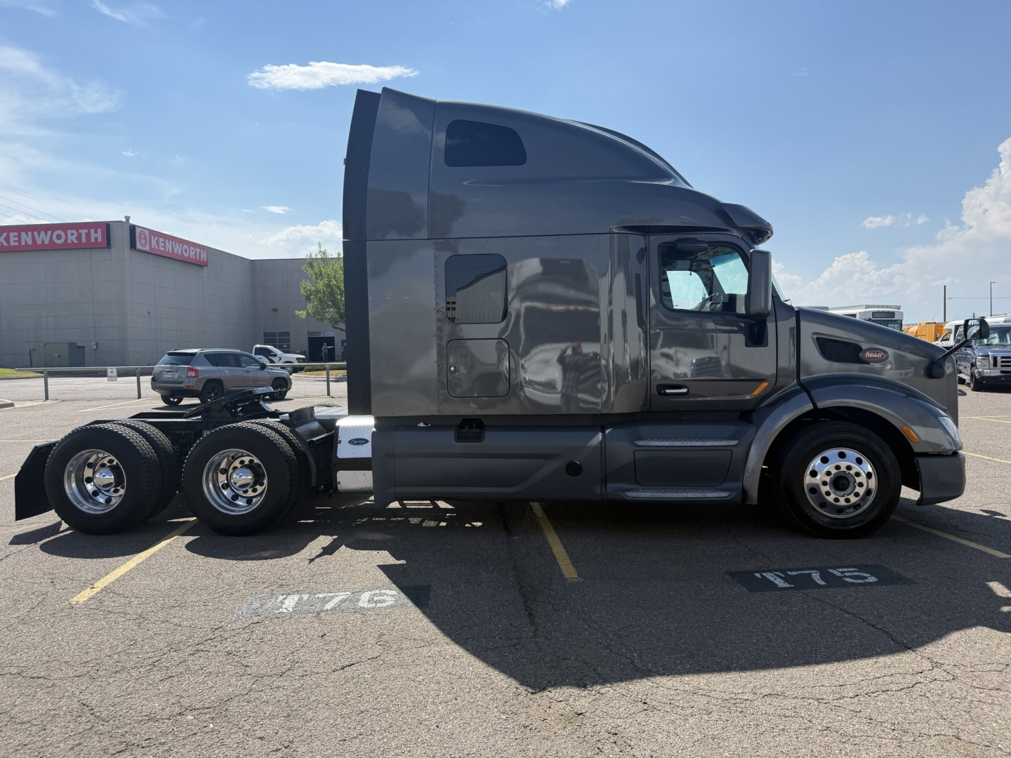 Peterbilt 579 tractor side view showing cab and dual rear axles without trailer.