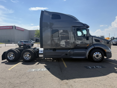 Peterbilt 579 tractor side view showing cab and dual rear axles without trailer.