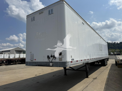 Trailer box showing raised landing gear and rear lighting on a Hyundai roll door van with a white logo of a flying bird on the side.