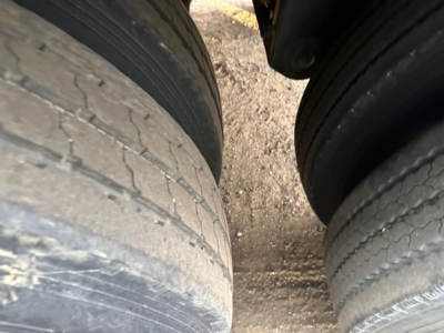 Tires of a 2020 Timpte Super Hopper trailer viewed from between the dual wheels.