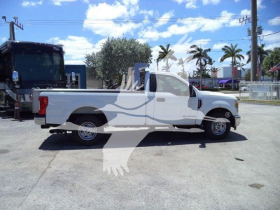 Ford F-250 SD XL pickup truck in white side profile view, extended cab, dump category, in a dealership lot.