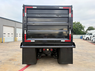 Dump truck bed of a 2020 Mack GR64F rear view showing dump bed and bumper details.
