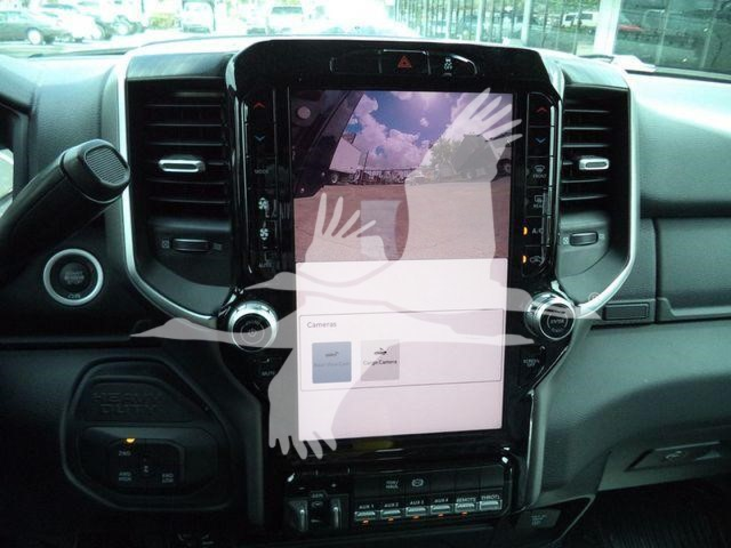 Ram 5500 dash with large vertical touchscreen display showing vehicle controls and camera view