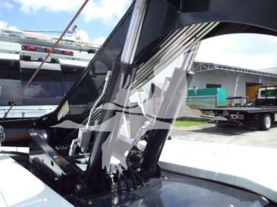 Ram 5500 winch truck with hydraulic crane arm and winch components visible