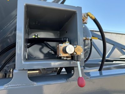 Ranco LW21-40 component mounted on a dump trailer showing a hydraulic control valve with red-handled lever and wiring harness.