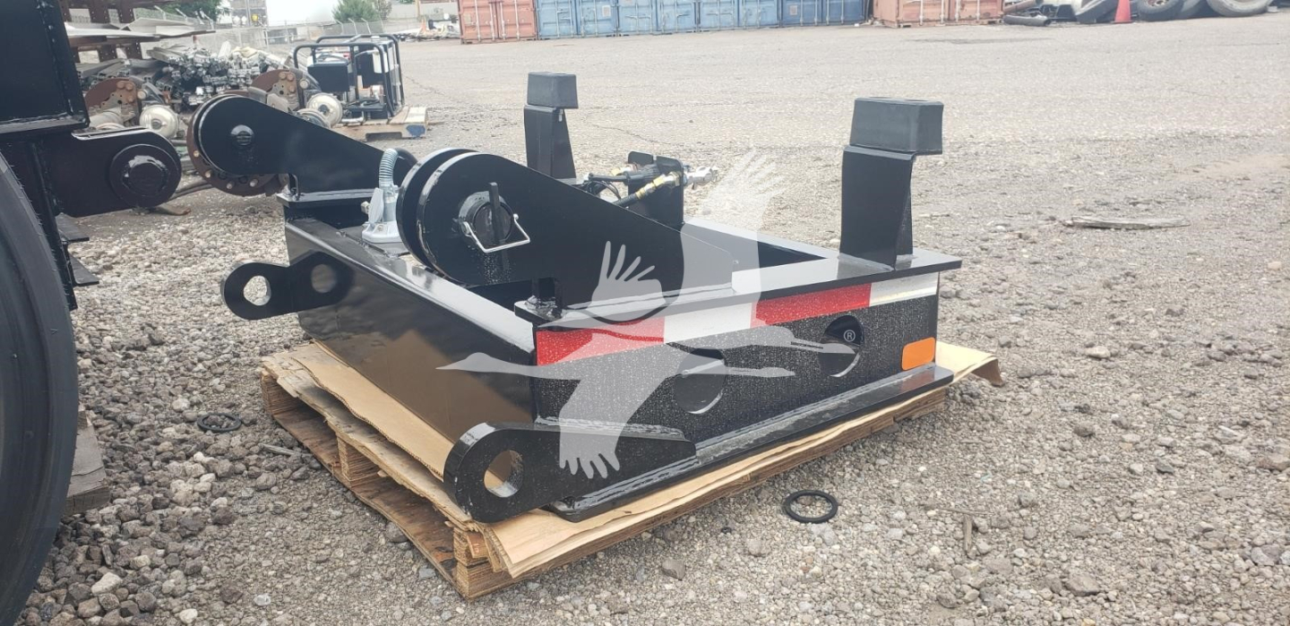 Heavy-duty Fontaine lowboy trailer frame on a pallet, black and metal components with mounting points and rollers visible.