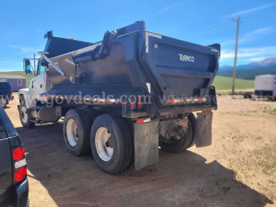 Ford LT9000 dump truck rear view showing Rasco/Ranco dump bed and dual rear axles with mud flaps.