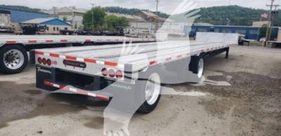 Trailer showing a white Transcraft D-Eagle II drop deck trailer with red and white reflective tape, dual rear lights, and black mud flaps; visible branding and taillight modules.