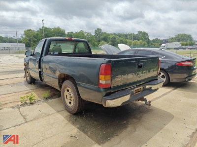Chevrolet Silverado 1500 pickup truck rear and left side view with extended cab, blue body, in-service condition.