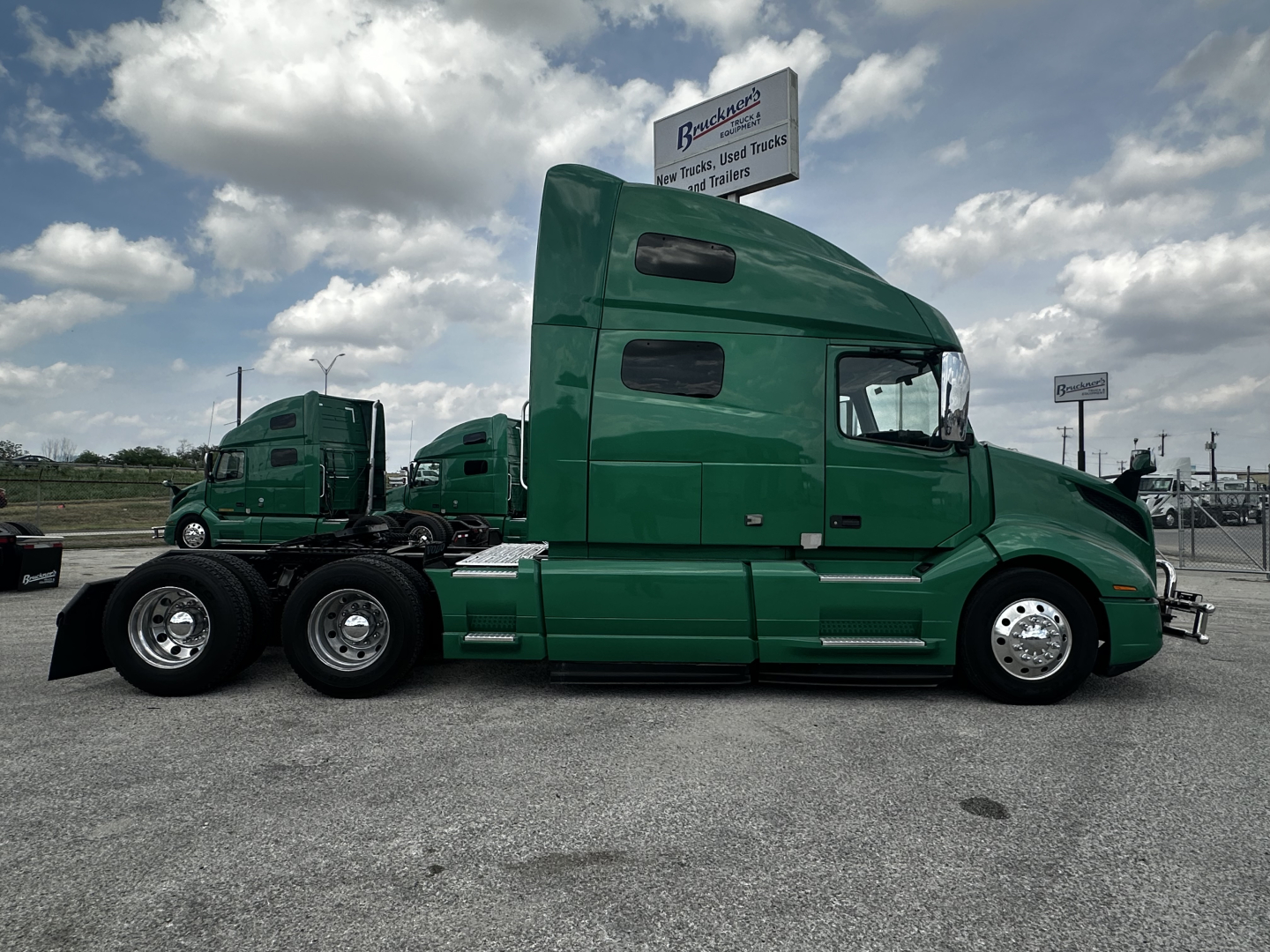 Volvo VNL64T760 truck side profile in green with sleeper cab and 6x4 layout.