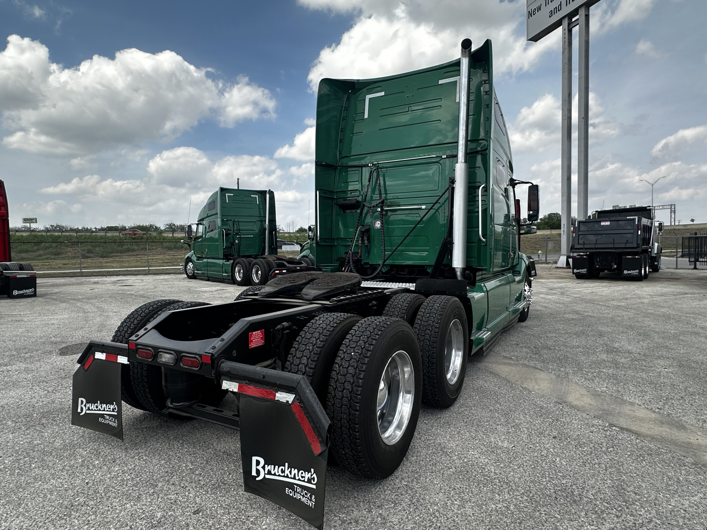Volvo VNL64T760 sleeper tractor rear view showing chassis, wheels, and fifth wheel with Bruckner's branding mud flaps.