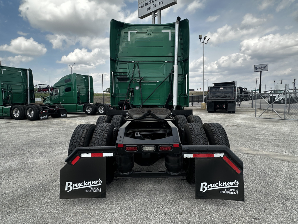 Volvo VNL64T760 tractor rear view showing chassis, dual rear axles, air lines, and mud flaps with Bruckner Truck Equipment logo.