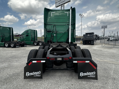Volvo VNL64T760 tractor rear view showing chassis, dual rear axles, air lines, and mud flaps with Bruckner Truck Equipment logo.